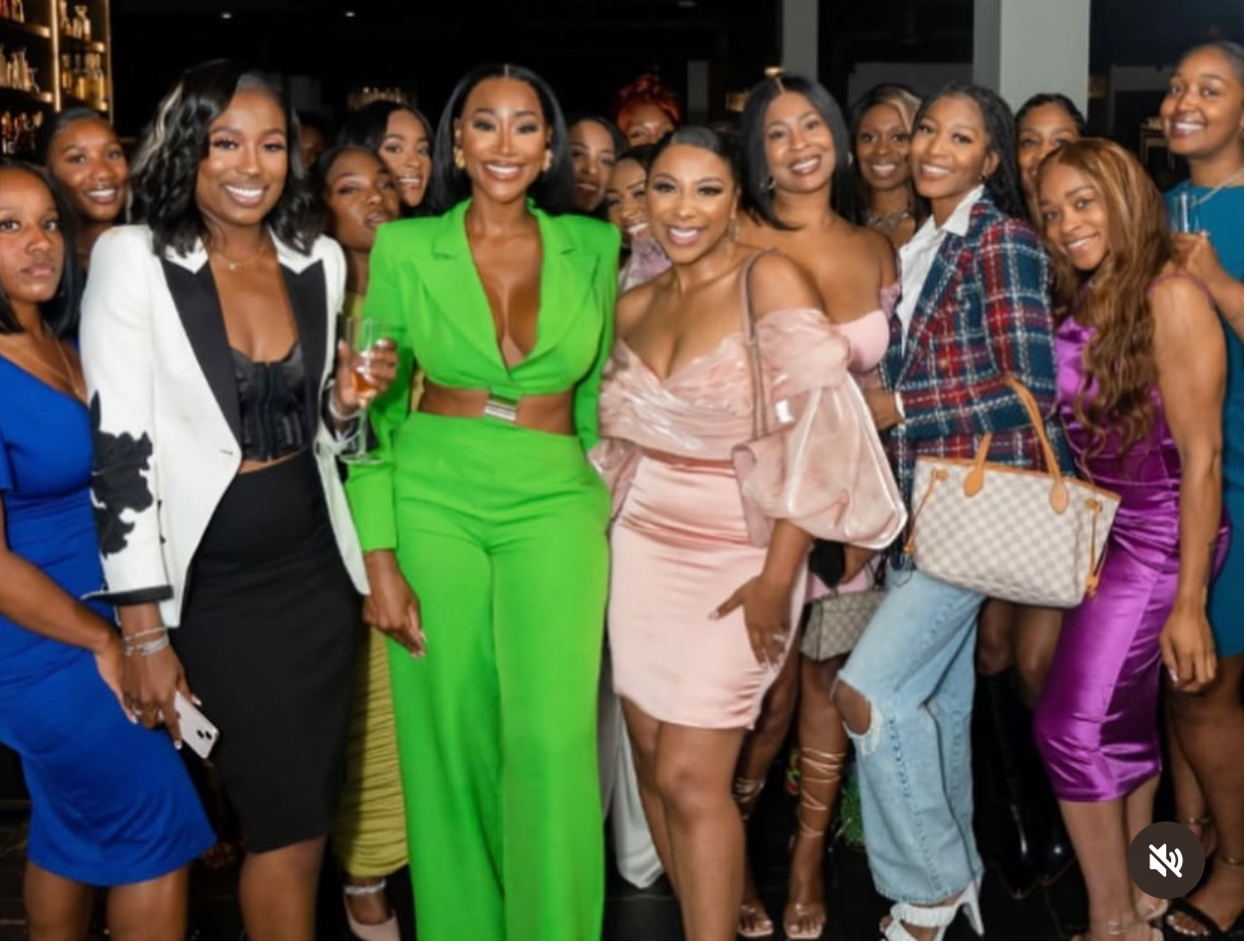 Ashley celebrating with a room full of women entrepreneurs