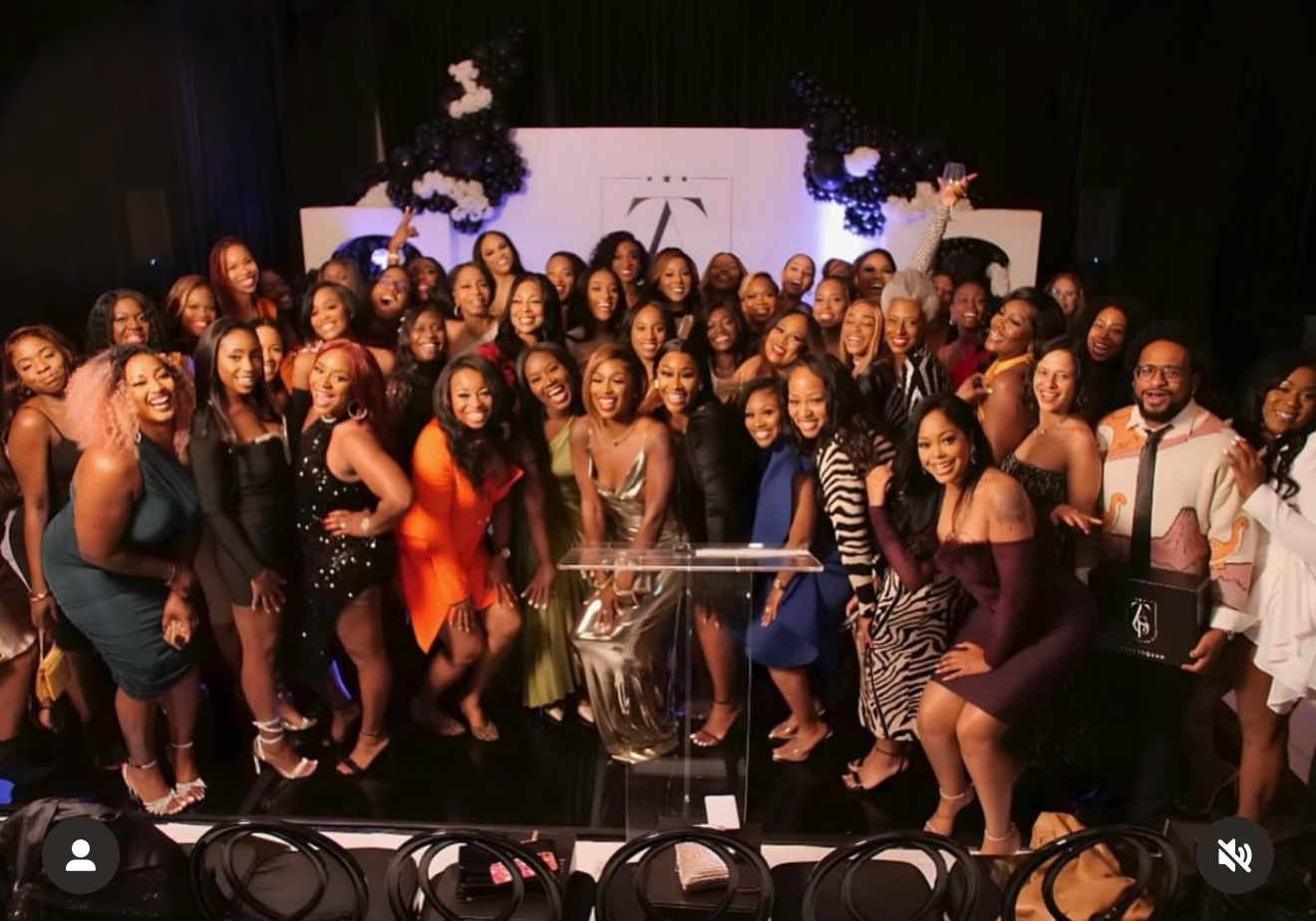 Ashley with her community of women entrepreneurs at a gala