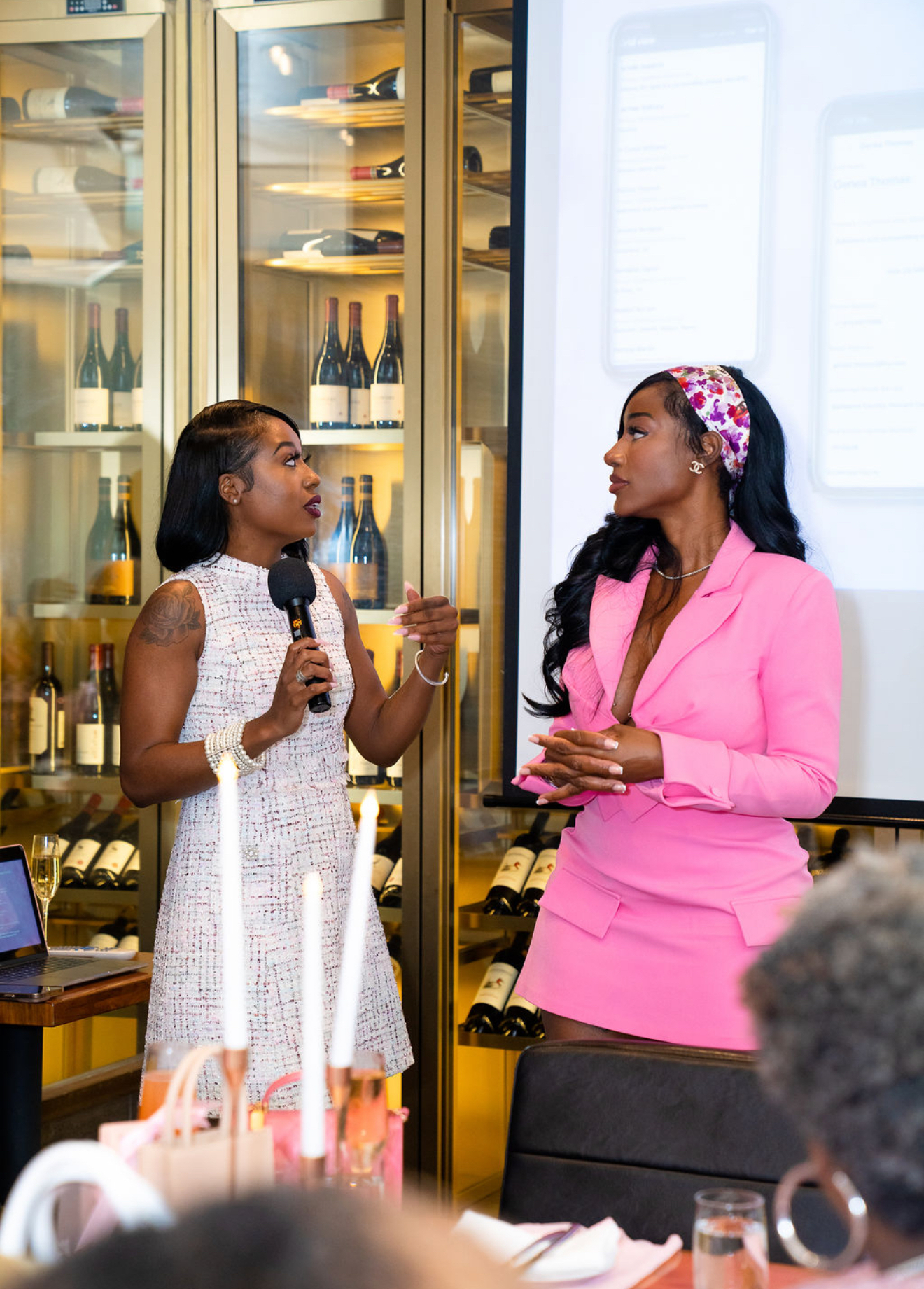 Ashley speaking on a panel at an intimate luxury event