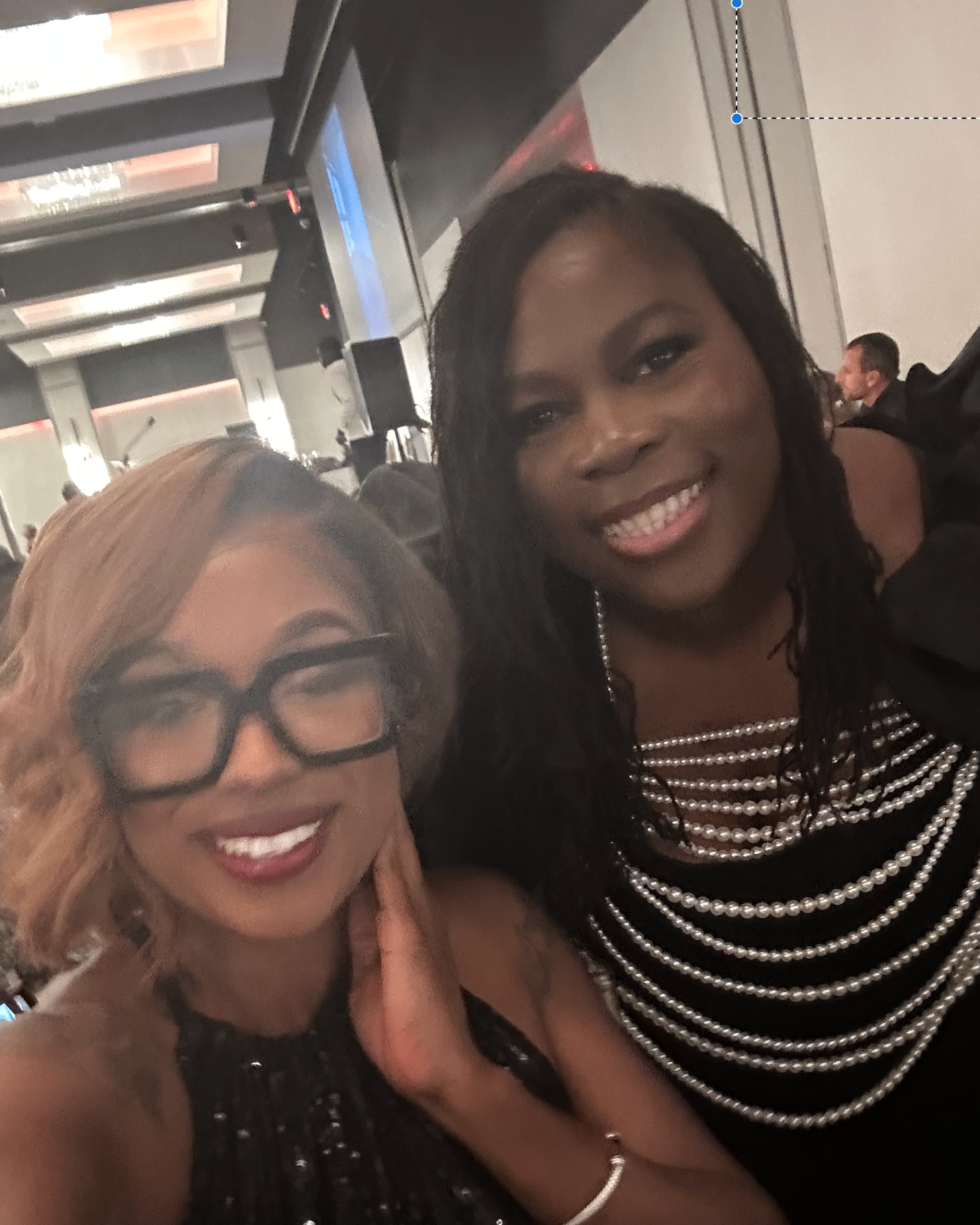 Ashley with a client at a black-tie gala