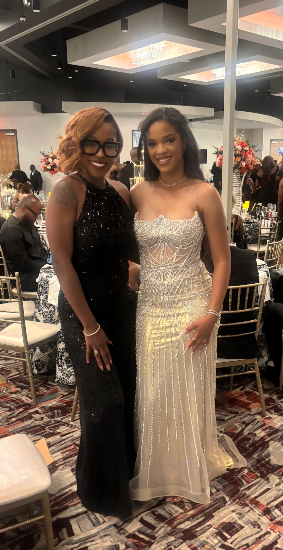 Ashley with a client at a formal black-tie gala
