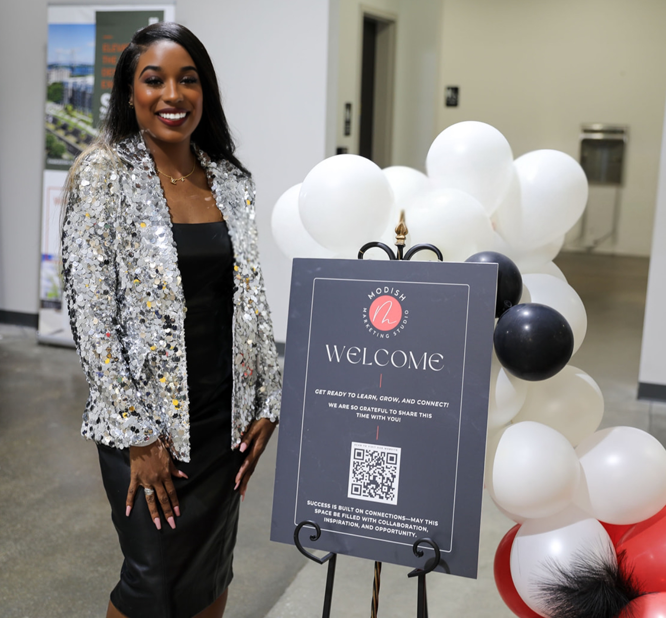 Ashley Lashun welcoming business owners at a live event